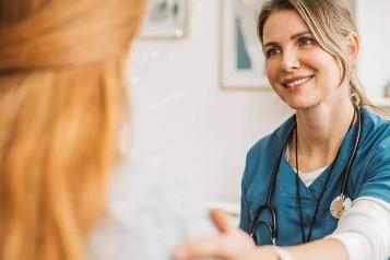 Female Doctor with red-haired patient