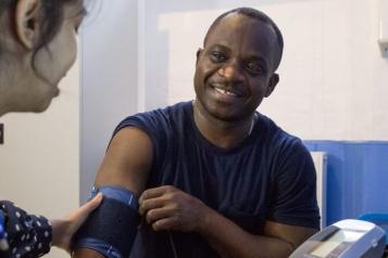 Black male patient having his blood pressure taken
